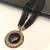 Black multi-strand beaded necklace with round gold leaf pendant, ethnic statement jewellery