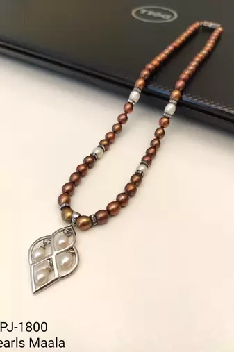Brown and white pearl beaded necklace with silver geometric pendant, rhinestone accents, magnetic clasp