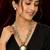 Multi-strand white and gold beaded necklace with round stone pendant, earrings set