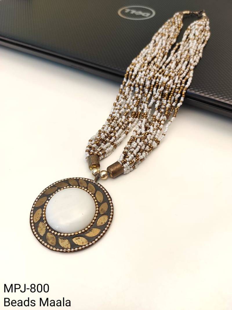 Multi-strand white and gold beaded necklace with round stone pendant, earrings set