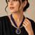 Blue & gold multi-strand beaded necklace with round medallion pendant, boho tribal style