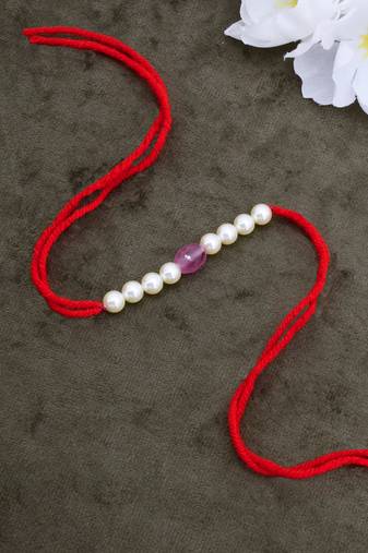 Designer pearl rakhi for brother - traditional pink bead thread