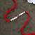 Designer pearl rakhi for brother - traditional pink bead thread