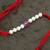 Designer pearl rakhi for brother - traditional pink bead thread