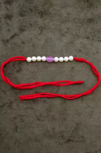 Designer pearl rakhi for brother - traditional pink bead thread