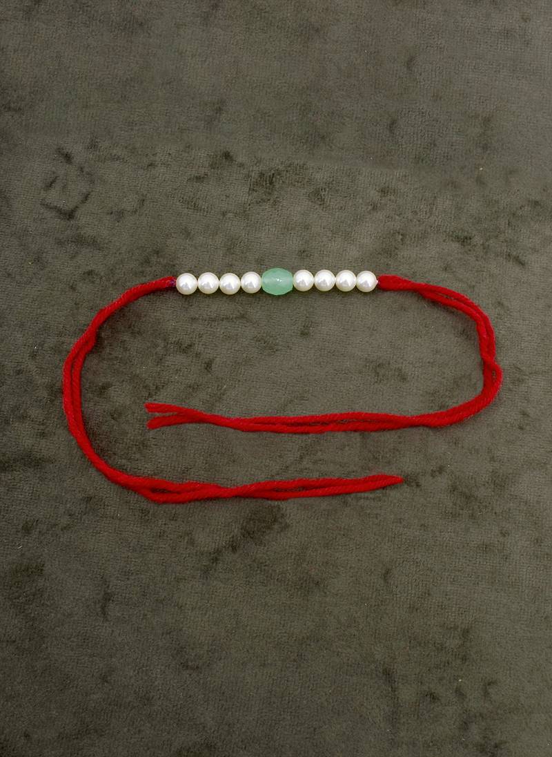 Designer pearl rakhi for brother - traditional aqua bead thread