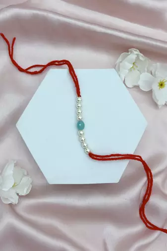 Designer pearl rakhi for brother - traditional sky blue bead thread