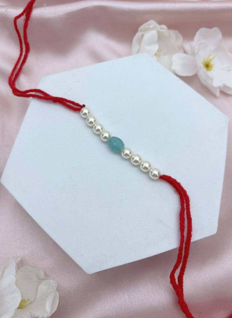 Designer pearl rakhi for brother - traditional sky blue bead thread
