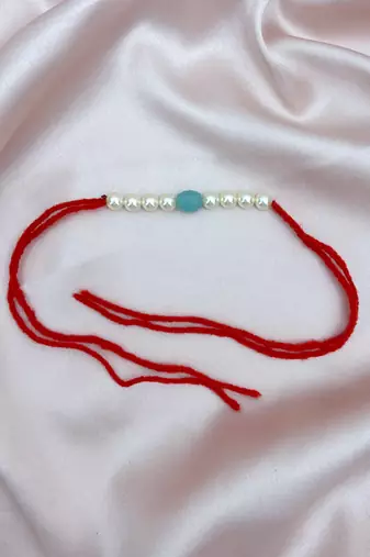 Designer pearl rakhi for brother - traditional sky blue bead thread