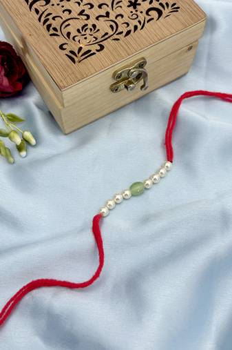 Designer pearl rakhi for brother - traditional mint bead thread