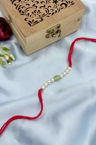 Designer pearl rakhi for brother - traditional mint bead thread