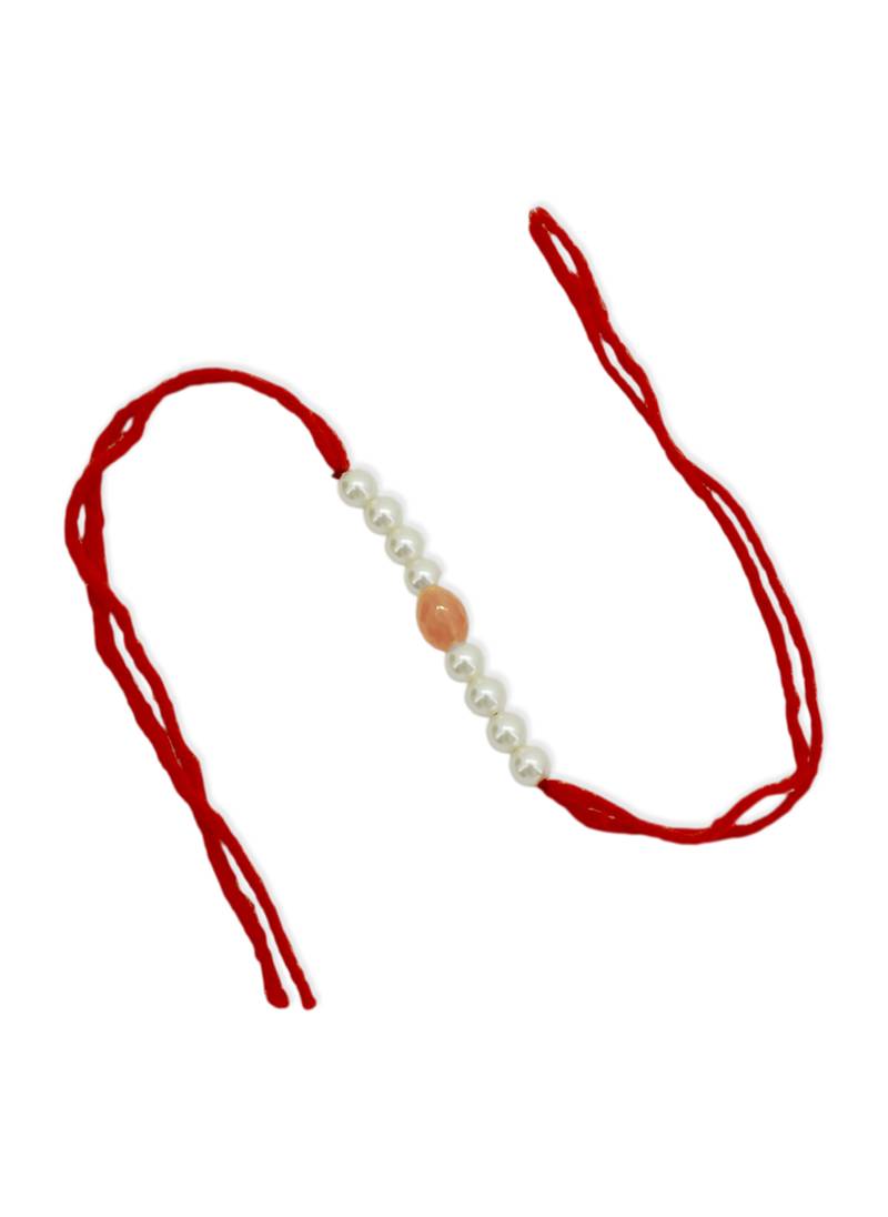Designer pearl rakhi for brother - traditional peach bead thread