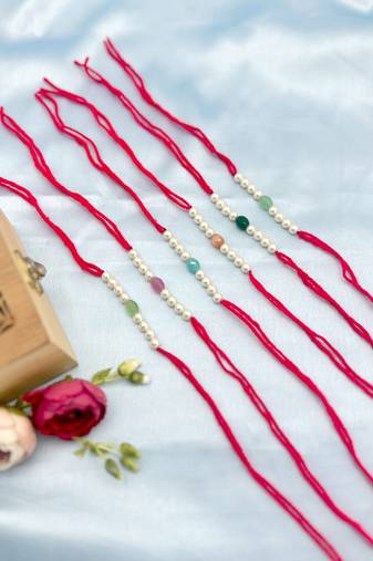 Designer pearl set of 6 rakhi for brother - traditional bead thread