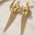 Gold plated orchid flower tassel chain earrings