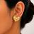 Gold ribbed wave heart stud earrings
