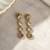 Gold plated linear drop earrings