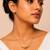 Metallic gold varka crescent pendant necklace