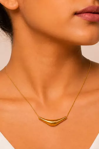 Metallic gold varka crescent pendant necklace