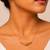 Metallic gold varka crescent pendant necklace