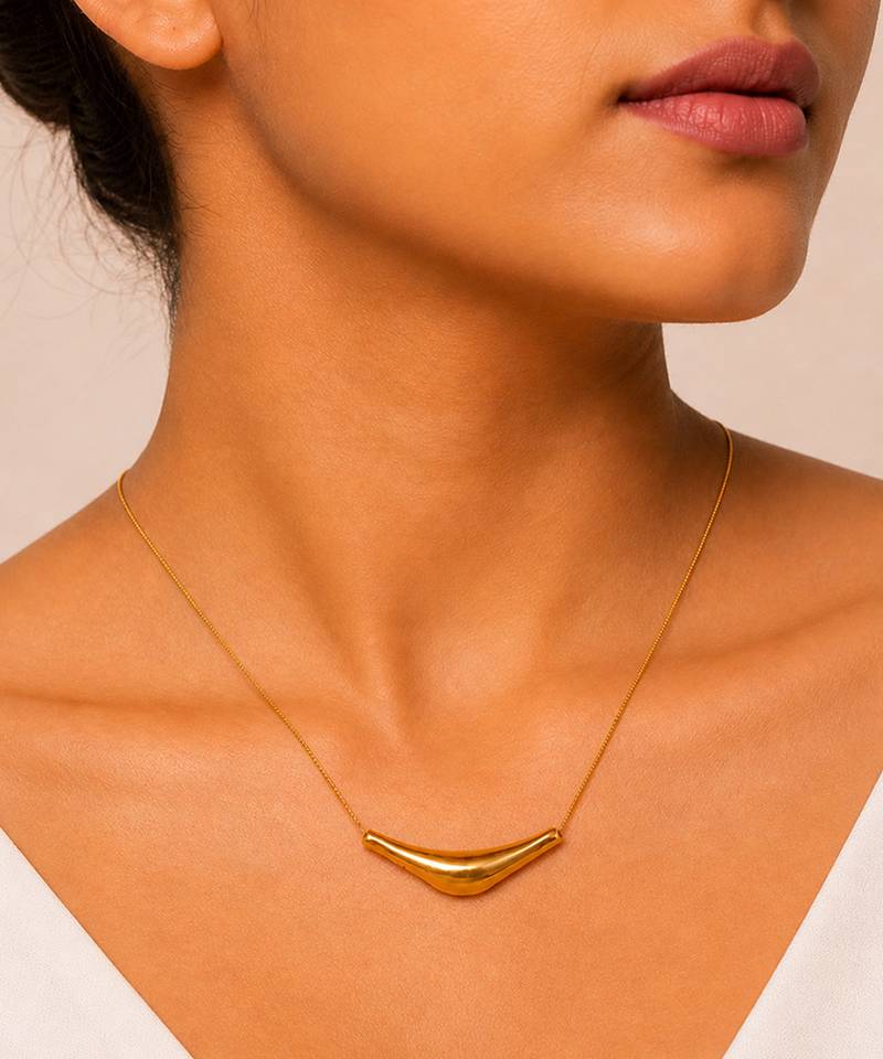 Metallic gold varka crescent pendant necklace