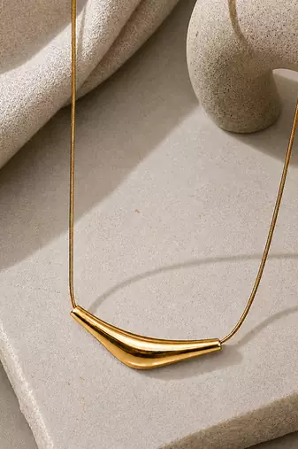 Metallic gold varka crescent pendant necklace