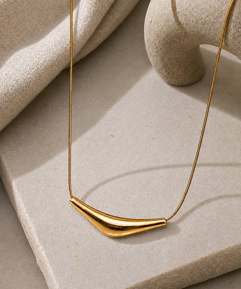Metallic gold varka crescent pendant necklace