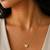 Gold mini heart pendant necklace