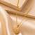 Gold heart pendant necklace