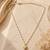 Gold bead chain heart necklace