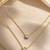 Gold double chain ball pendant necklace