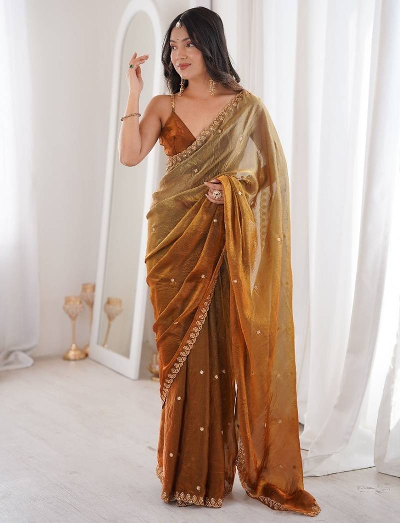 Gold colour fendy satin sequins embroidered saree with unstitched blouse