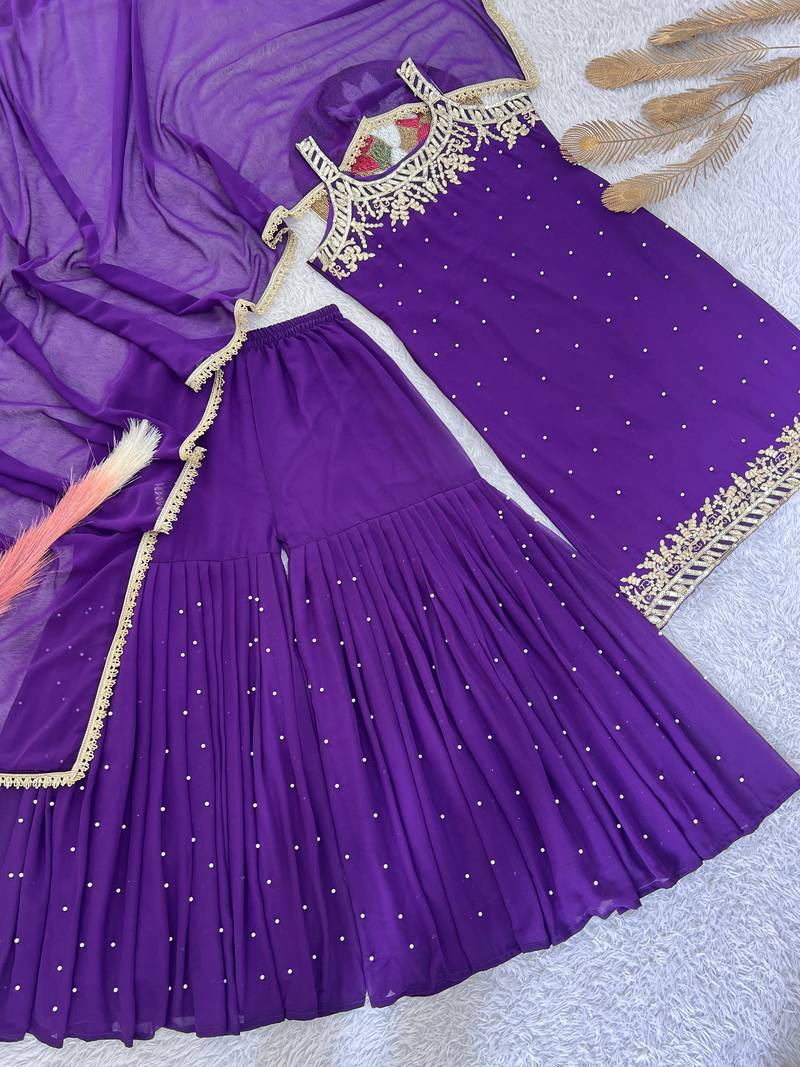 Purple colour faux georgette embroidered sharara suit with dupatta