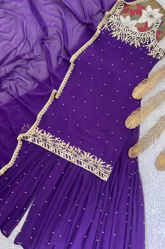 Purple colour faux georgette embroidered sharara suit with dupatta