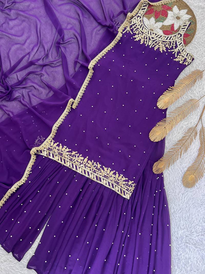 Purple colour faux georgette embroidered sharara suit with dupatta