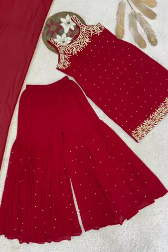 Red faux georgette embroidered sharara suit with dupatta