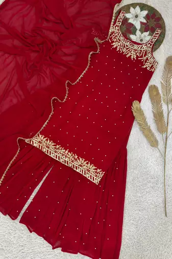 Red faux georgette embroidered sharara suit with dupatta