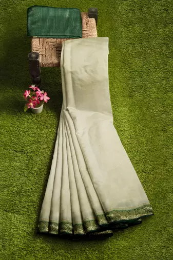 Cream & dark green zari border saree