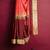 Coral pink & maroon zari saree