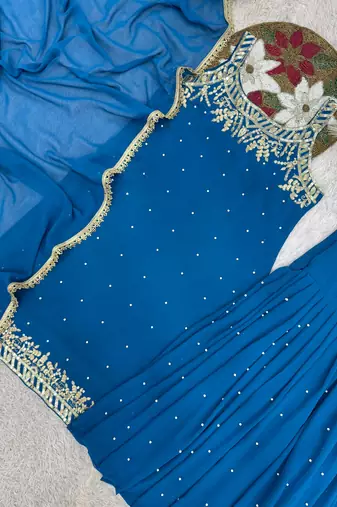 Blue faux georgette embroidered sharara suit with dupatta
