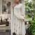 Elegant white straight kurti pant set with rose motif embroidery for women