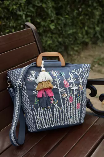   thread bloom navy floral embroidered cotton canvas handheld bag