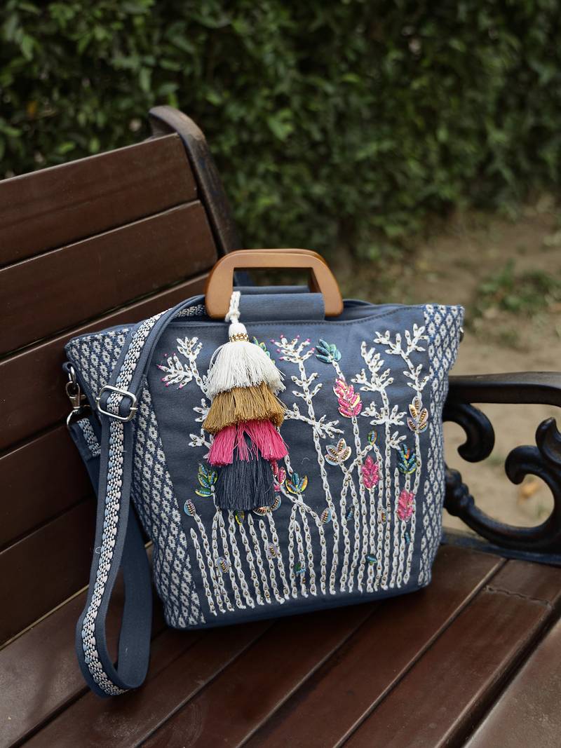   thread bloom navy floral embroidered cotton canvas handheld bag
