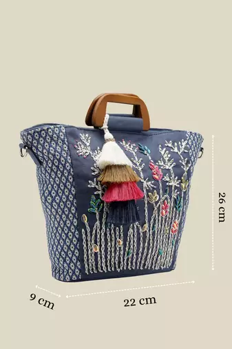   thread bloom navy floral embroidered cotton canvas handheld bag