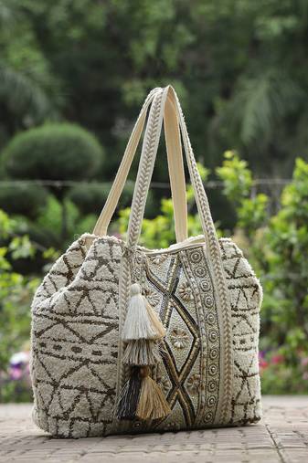   folklore edit ivory geometric shell embellished jacquard hobo bag