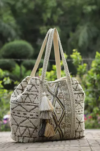   folklore edit ivory geometric shell embellished jacquard hobo bag
