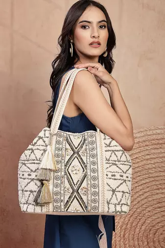   folklore edit ivory geometric shell embellished jacquard hobo bag