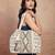   folklore edit ivory geometric shell embellished jacquard hobo bag