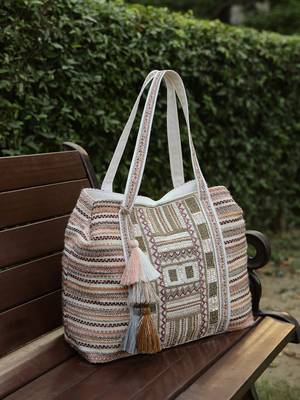  folklore edit blush pink tribal geometric jacquard hobo bag 1