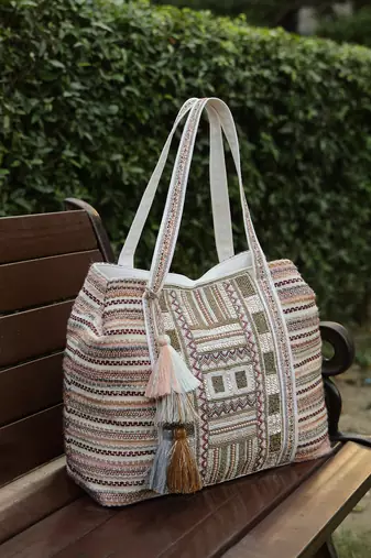   folklore edit blush pink tribal geometric jacquard hobo bag