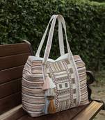   folklore edit blush pink tribal geometric jacquard hobo bag
